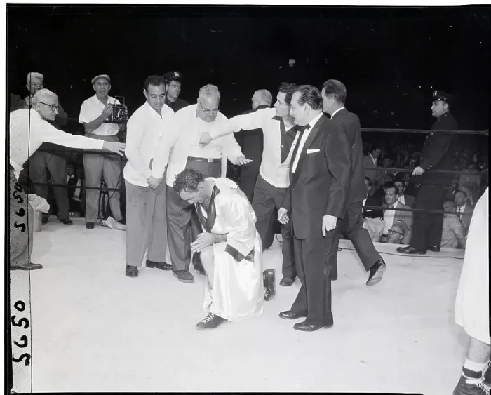 Framed Print : Carmen Basilio Kneels in Prayer in Ring Framed Print : Carmen Basilio Kneels in Prayer in Ring