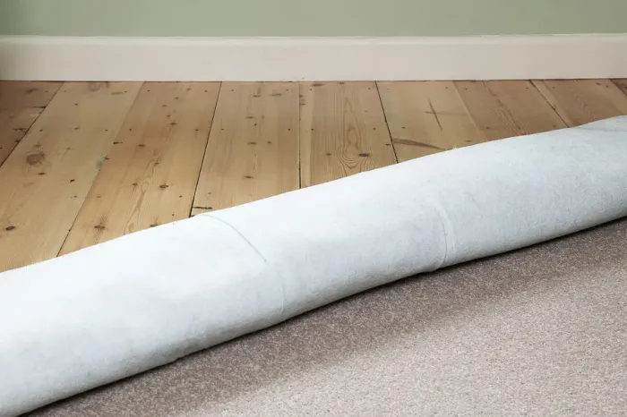 Framed Print : Carpet rolled back to reveal floorboards Framed Print : Carpet rolled back to reveal floorboards