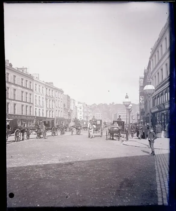 Framed Print : Carriages Moving Along St. Patrick's Street Framed Print : Carriages Moving Along St. Patrick's Street