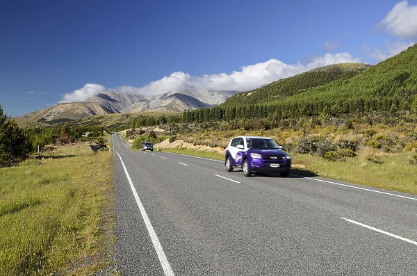 Two cars driving on a country road, driving on the left, Arthurs Pass Road, South Island, New Zealand, Oceania