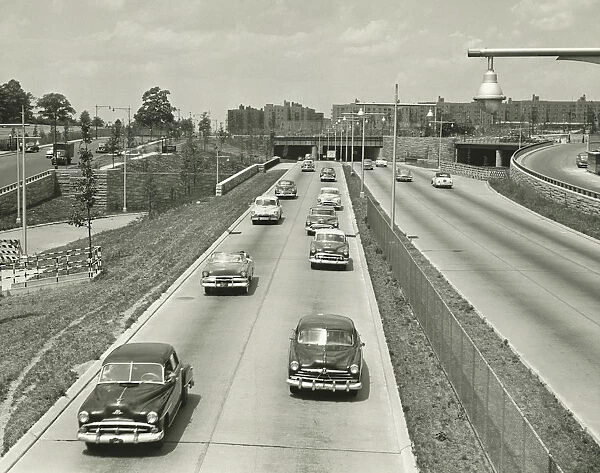 Cars on two lane highway, (B&W), elevated view