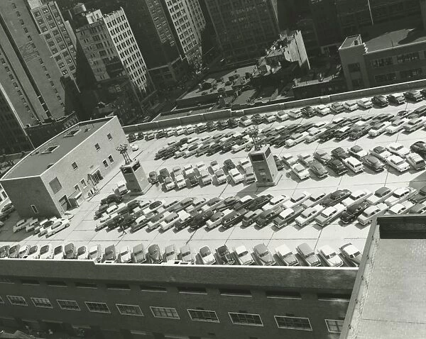 Cars on top level of parking lot, (B&W), (elevated view