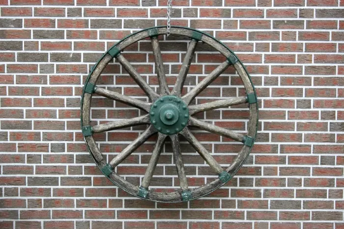 Framed Print : Cart wheel on a clinker brick facade in East Friesland, Lower Saxony, Germany, Europe Framed Print : Cart wheel on a clinker brick facade in East Friesland, Lower Saxony, Germany, Europe