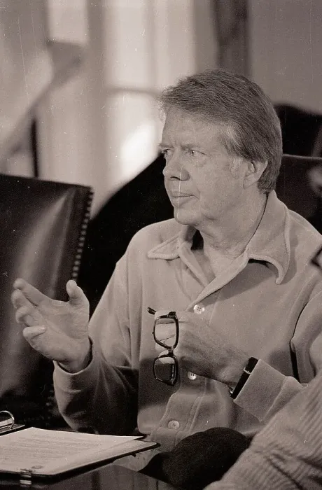 Framed Print : Carter Holds Glasses During Meeting Framed Print : Carter Holds Glasses During Meeting