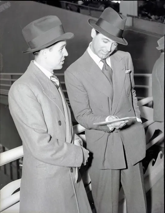 Framed Print : Cary Grant and Alfred Gwynne Vanderbilt Looking at Program Framed Print : Cary Grant and Alfred Gwynne Vanderbilt Looking at Program