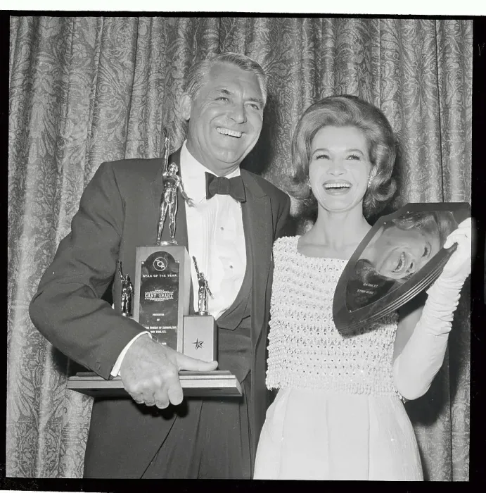 Framed Print : Cary Grant and Angie Dickinson Holding Awards Framed Print : Cary Grant and Angie Dickinson Holding Awards