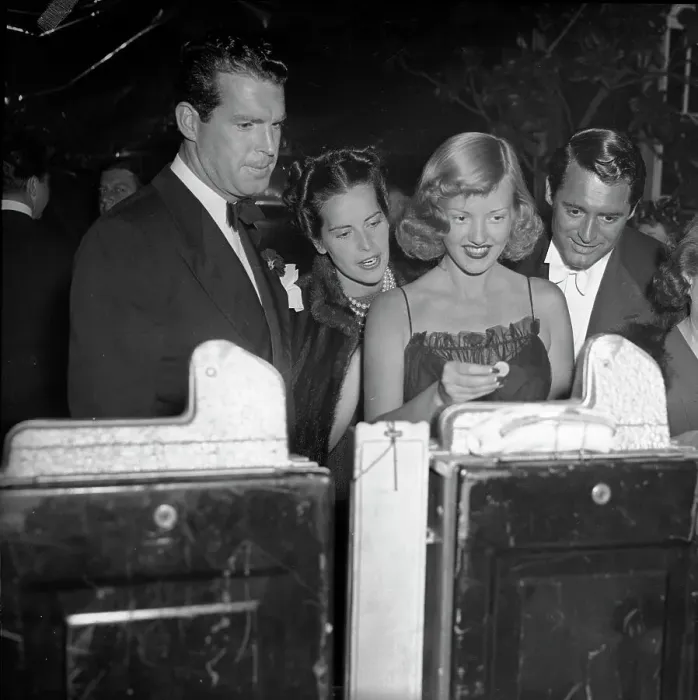 Framed Print : Cary Grant and Others Playing Slot Machine Framed Print : Cary Grant and Others Playing Slot Machine