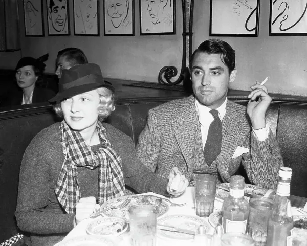 Cary Grant and Wife at the Hollywood Brown Derby Cafe Print. Art