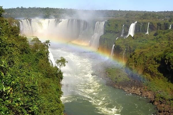 Cascades with rainbow Iguazu Waterfalls Argentina Brazil