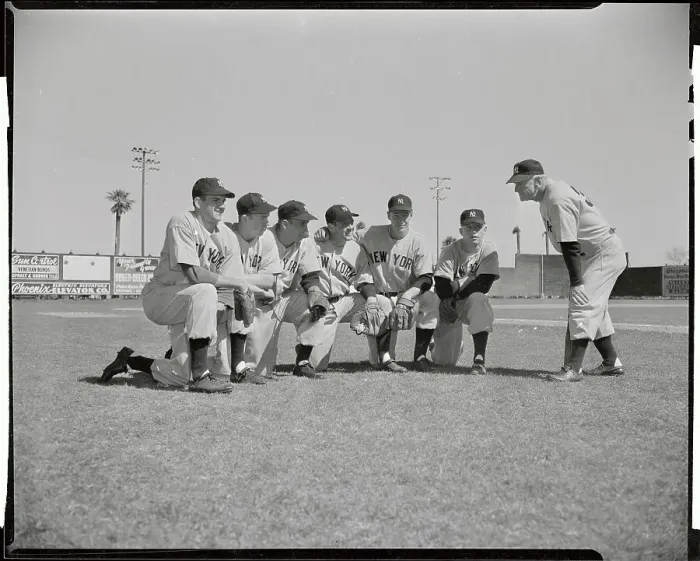 Framed Print : Casey Stengel Bending to Talk to Players Crouched on Field Framed Print : Casey Stengel Bending to Talk to Players Crouched on Field