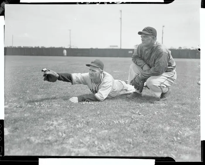 Framed Print : Casey Stengel and Dan Taylor Conversing While Lying on Field