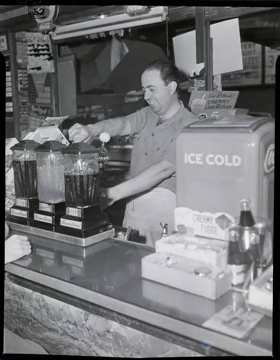 Framed Print : Cashier Pouring Drink In Soda Shop Framed Print : Cashier Pouring Drink In Soda Shop