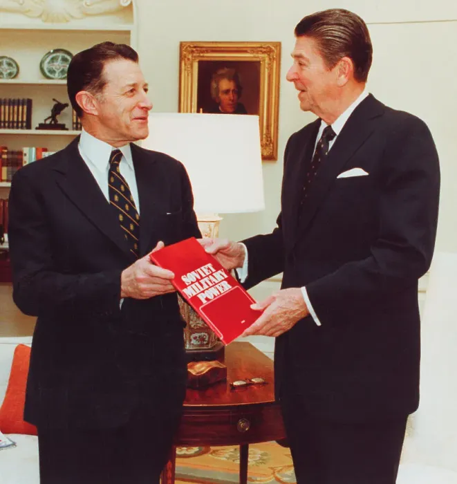 Framed Print : Caspar Weinberger Handing Ronald Reagan a Book Framed Print : Caspar Weinberger Handing Ronald Reagan a Book