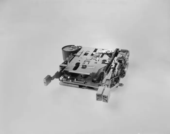 Framed Print : A cassette or disc player part on white background Framed Print : A cassette or disc player part on white background