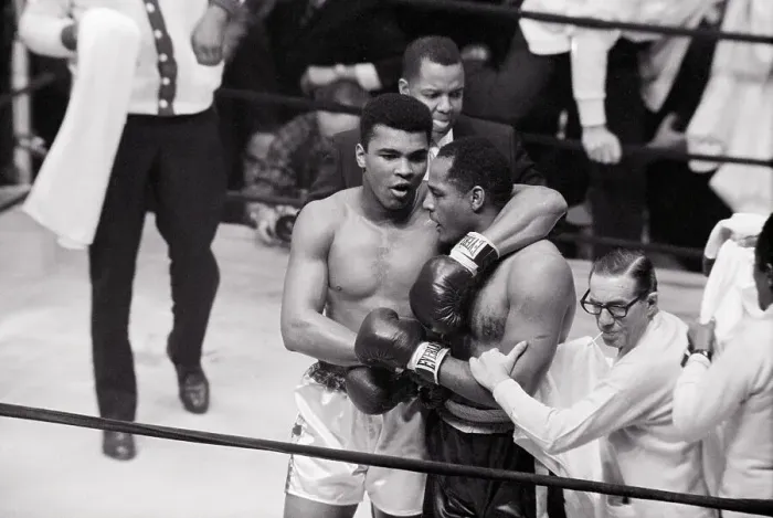 Framed Print : Cassius Clay with Arm Around Zora Folley Framed Print : Cassius Clay with Arm Around Zora Folley