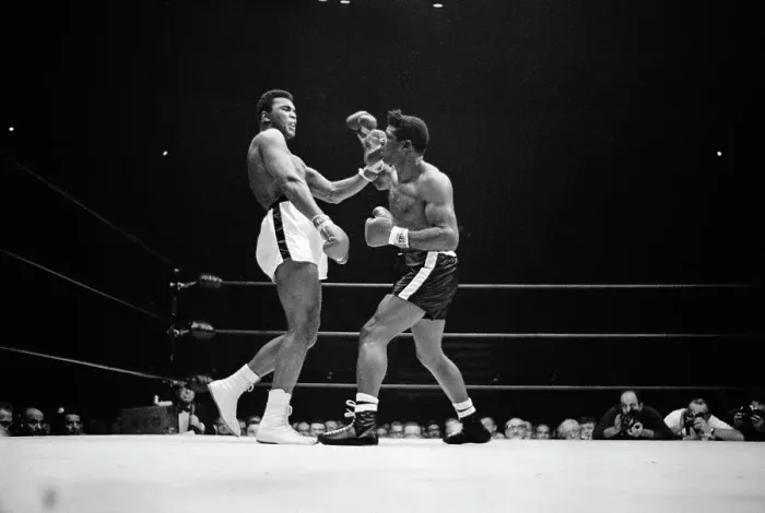 Framed Print : Cassius Clay Brushing Off Punches