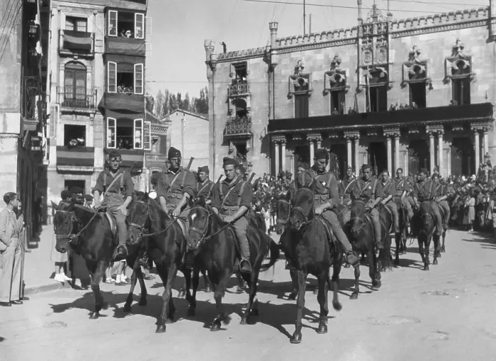 Framed Print : Cavalry Troops Ride Through Town On Horses