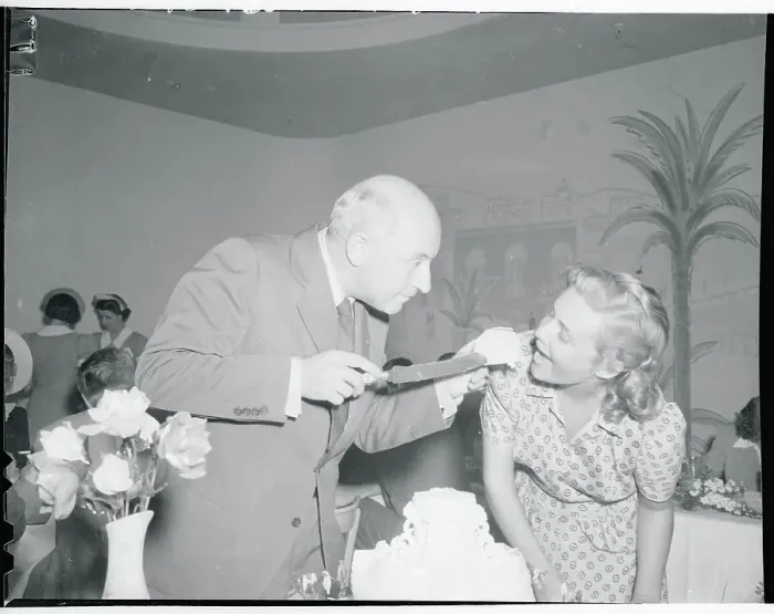 Framed Print : Cecil B. Demille Feeding Cake to Madeleine Carroll Framed Print : Cecil B. Demille Feeding Cake to Madeleine Carroll
