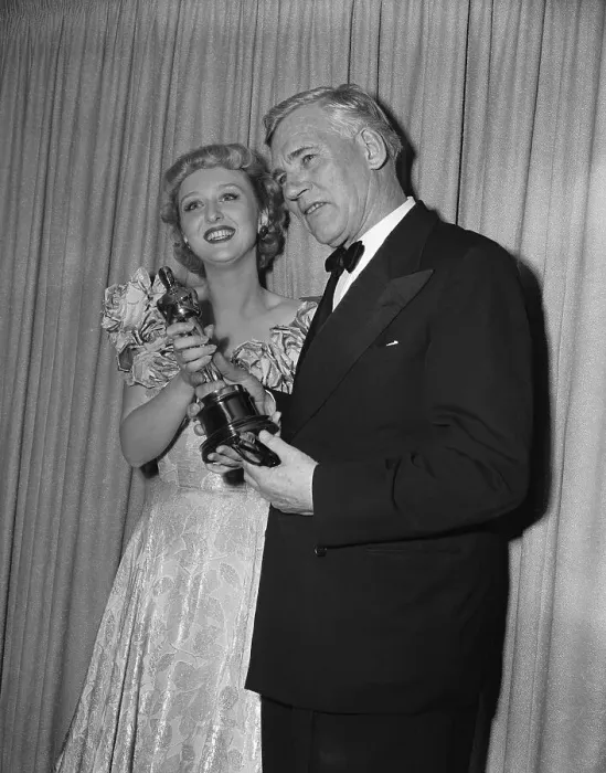 Framed Print : Celeste Holm and Walter Huston Holding Oscar Framed Print : Celeste Holm and Walter Huston Holding Oscar