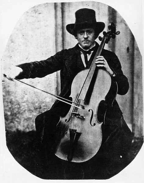 Cellist. circa 1850: A street musician playing the cello