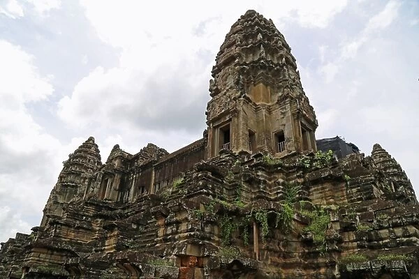 Central sanctuary of Angkor Wat with vegetation