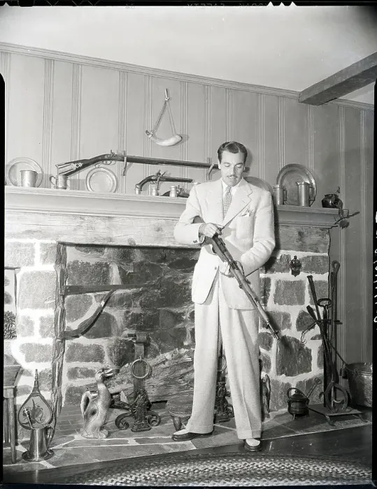 Framed Print : Cesar Romero Checking Gun In Living Room Framed Print : Cesar Romero Checking Gun In Living Room