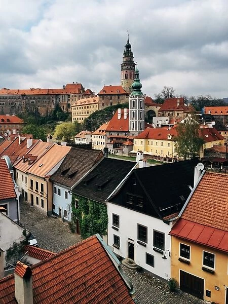 Cesky Krumlov cityscape with castle and tower in the background, South Bohemia, Czech Republic