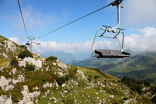 Chair lift over rocky mountainside