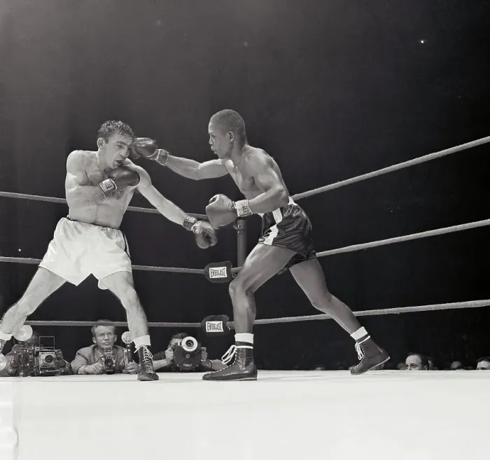 Framed Print : Challenger Johnny Saxton Attacks defending welterweight champion Carmen Basilio, left, during 9th round their title bout at Chicago Stadium 3 / 14. Saxton took a 15 round decision and the crown from Basilio Framed Print : Challenger Johnny Saxton Attacks defending welterweight champion Carmen Basilio, left, during 9th round their title bout at Chicago Stadium 3 / 14. Saxton took a 15 round decision and the crown from Basilio