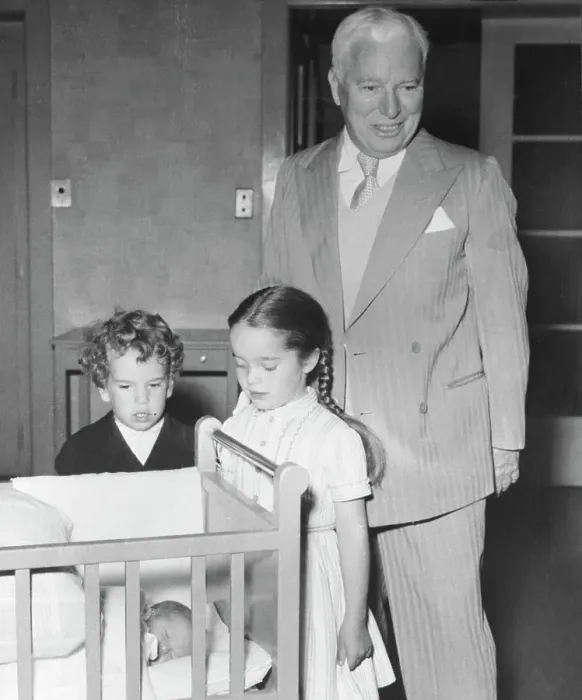 Framed Print : Chaplin Admiring Newborn Framed Print : Chaplin Admiring Newborn