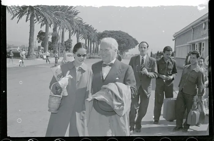 Framed Print : Charles Chaplin Strolling with His Wife Framed Print : Charles Chaplin Strolling with His Wife