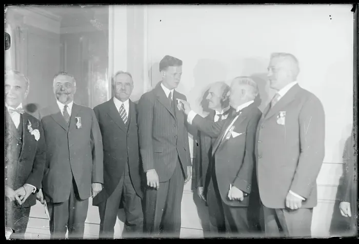 Framed Print : Charles Lindbergh Being Pinned by Governmental Official Framed Print : Charles Lindbergh Being Pinned by Governmental Official