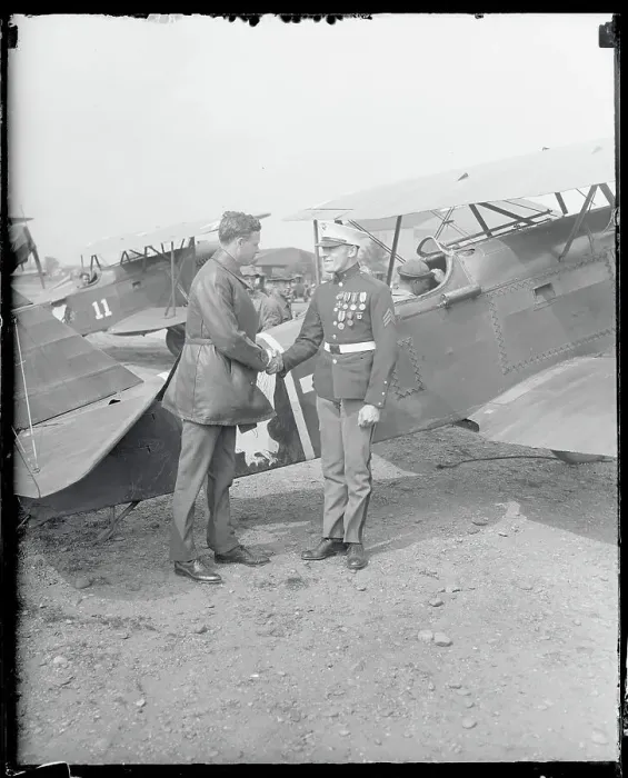 Framed Print : Charles Lindbergh Shaking Hand of Marine Near Airplane Framed Print : Charles Lindbergh Shaking Hand of Marine Near Airplane