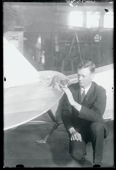 Framed Print : Charles Lindbergh Sitting at Airplane With Kitten Mascot on a Wing Framed Print : Charles Lindbergh Sitting at Airplane With Kitten Mascot on a Wing