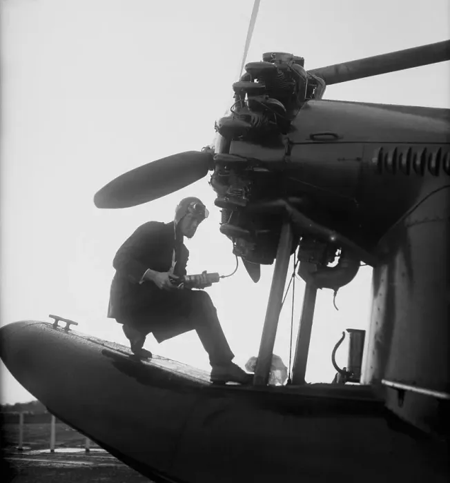Framed Print : Charles Lindbergh Working on Plane