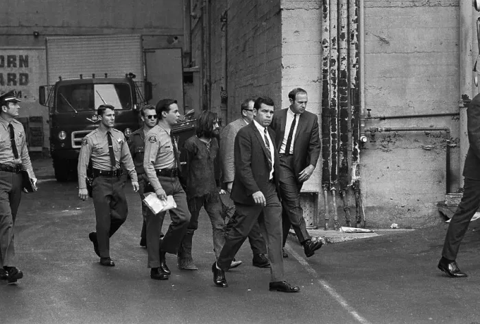 Framed Print : Charles Manson Led Away After Arraignment