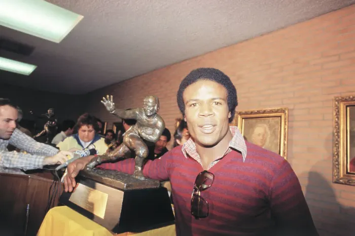 Framed Print : Charles White Posing with Heisman Trophy