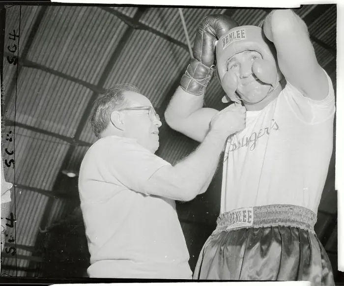 Framed Print : Charley Goldman Helping Rocky Marciano Put on His Headgear Framed Print : Charley Goldman Helping Rocky Marciano Put on His Headgear