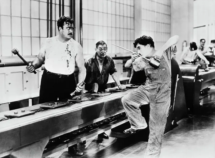 Framed Print : Charlie Chaplin Antagonizing Coworker Framed Print : Charlie Chaplin Antagonizing Coworker