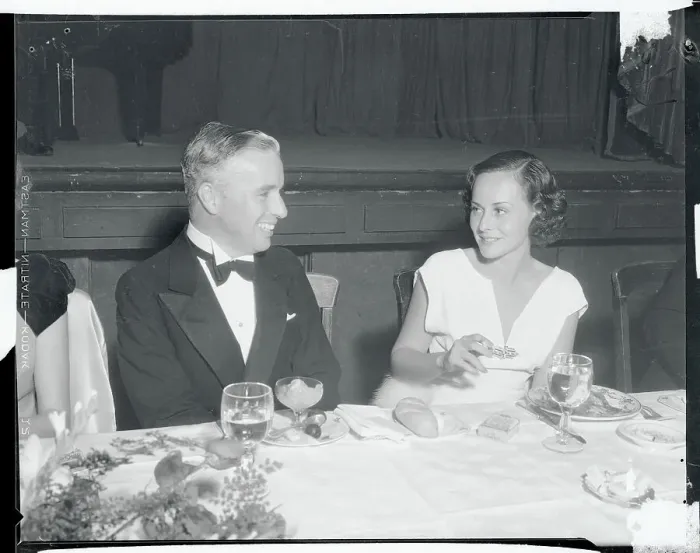Framed Print : Charlie Chaplin Chatting with Paulette Goddard Framed Print : Charlie Chaplin Chatting with Paulette Goddard
