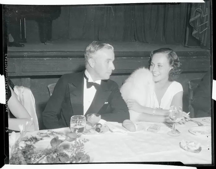 Framed Print : Charlie Chaplin Chatting with Paulette Goddard