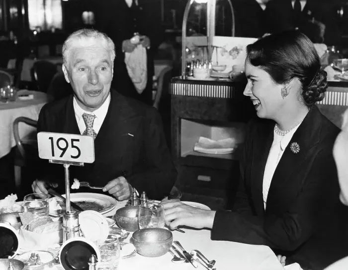Framed Print : Charlie Chaplin Dining with Oona Chaplin Framed Print : Charlie Chaplin Dining with Oona Chaplin