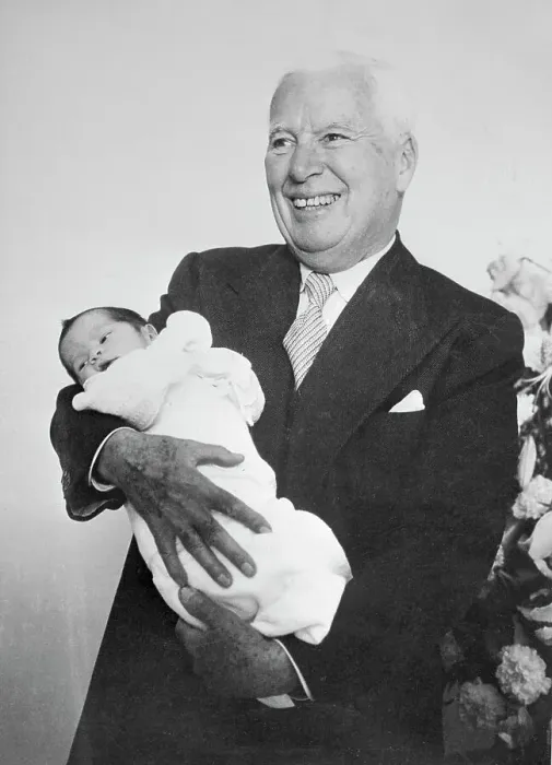 Framed Print : Charlie Chaplin Holding Newborn Son Framed Print : Charlie Chaplin Holding Newborn Son