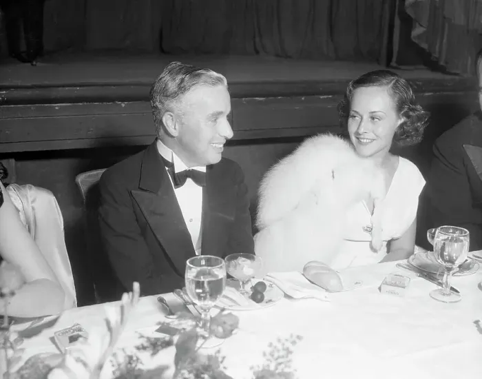 Framed Print : Charlie Chaplin and Paulette Goddard at Banquet Framed Print : Charlie Chaplin and Paulette Goddard at Banquet