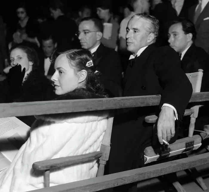 Framed Print : Charlie Chaplin and Paulette Goddard Watching a Play Framed Print : Charlie Chaplin and Paulette Goddard Watching a Play