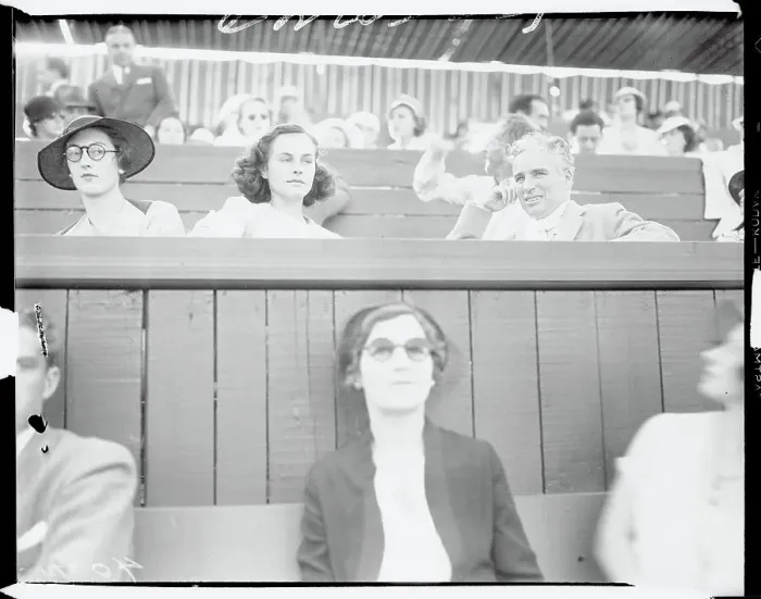 Framed Print : Charlie Chaplin and Paulette Goddard Watching a Tennis Match Framed Print : Charlie Chaplin and Paulette Goddard Watching a Tennis Match