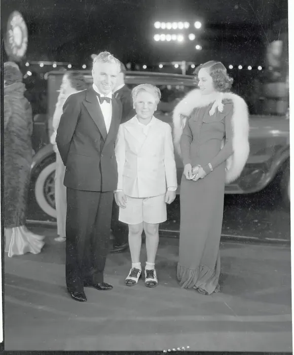 Framed Print : Charlie Chaplin Posing with Paulette Goddard and Jackie Cooper Framed Print : Charlie Chaplin Posing with Paulette Goddard and Jackie Cooper