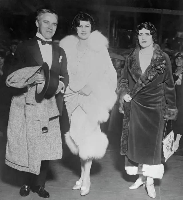 Framed Print : Charlie Chaplin Posing with His Wife and a Friend Framed Print : Charlie Chaplin Posing with His Wife and a Friend