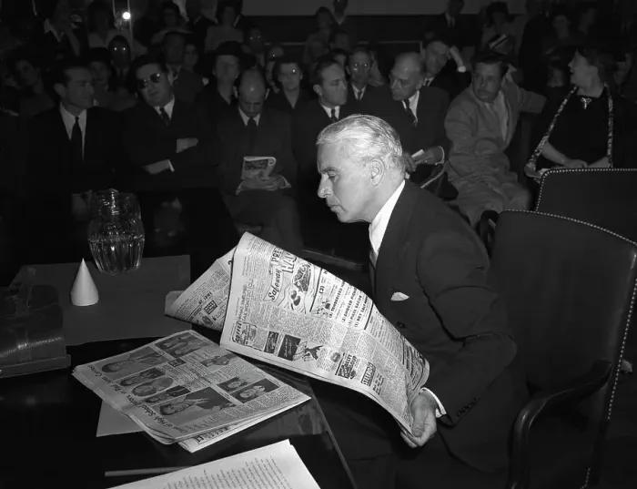 Framed Print : Charlie Chaplin Reading a Newspaper Framed Print : Charlie Chaplin Reading a Newspaper