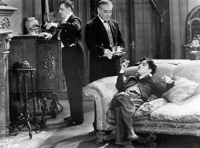 Framed Print : Charlie Chaplin Reclining On A Sofa